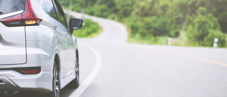 Close up front of new silver car parking on the asphaltの写真素材