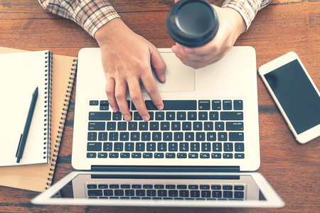new normal for social distancing, businessman is working online with computers at homeの写真素材