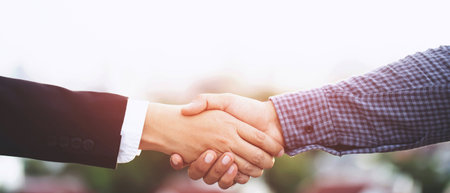 Business people shake hands together to do new business