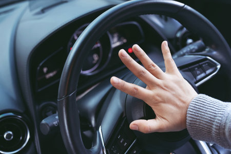 Angry driver is honking and is yelling by sitting of a steering wheel.Traffic jam.