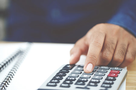 Accountants are calculating financial statements for annual taxes.