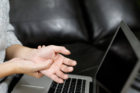 Hand pain women Muscle pain while working at the computerの写真素材