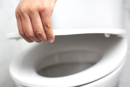 Open the lid of the toilet seat. To clean the bathroomの写真素材