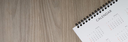 White clean calendar on  wood  background with copy spaceの写真素材