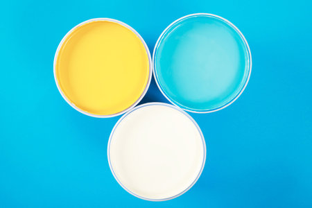 Paint cans color palette with paint brush on yellow background,home renovation conceptの写真素材