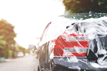 Outdoor car wash with active foam soap. commercial cleaning washing service concept.の写真素材