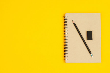 Concept of education top view notebooks and accessories stationery in the library at school yellow...