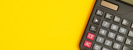 calculator for accountant on yellow backgroundの写真素材