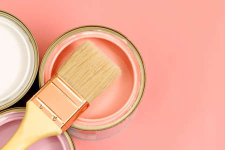 Paint cans and paint brushes and how to choose the perfect interior paint color and good for healthの写真素材