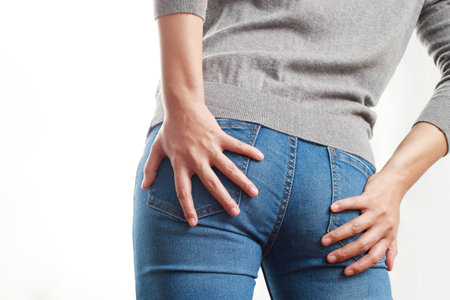 concept of health problems woman has hemorrhoidsの写真素材