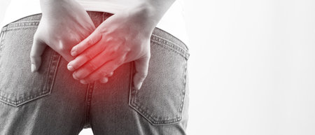 concept of health problems woman has hemorrhoidsの写真素材
