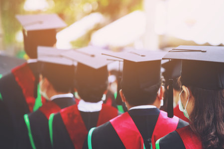 Image blur education graduates wear masks to prevent the spread of virusの写真素材