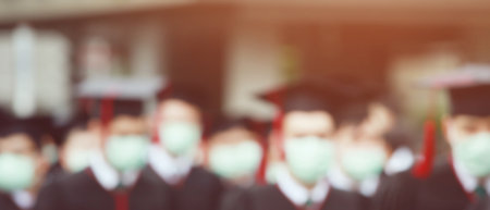 Picture blur graduates wear masks to prevent the spread