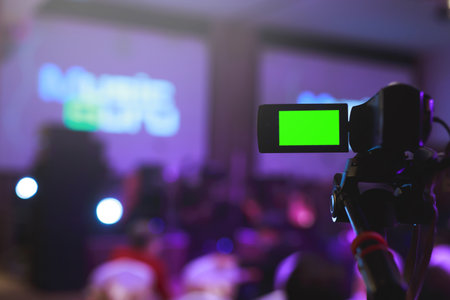 Photographer recording video footage of the seminar