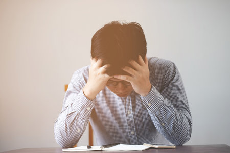 Headaches can have an underlying cause, such as insufficient sleep, incorrect eyeglasses, stress, hearing loud noises.の写真素材