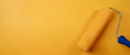 Roller Brush Painting, Worker painting on surface wall  Painting apartment, renovating with yellow...