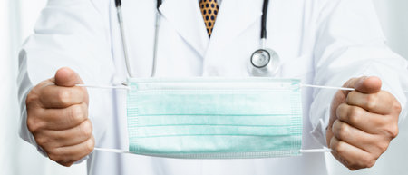 Doctor is wearing masks to prevent covid 19の写真素材