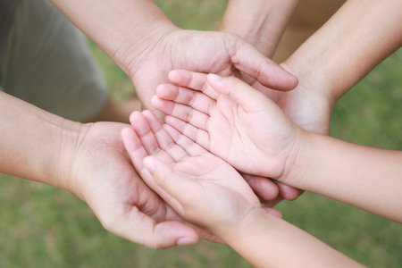 Children's hands with the warmth of mother's care