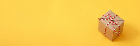 gift box brown new year yellow background