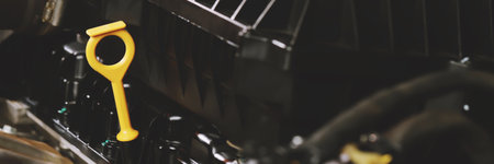 The mechanic is checking the engine oil.の写真素材