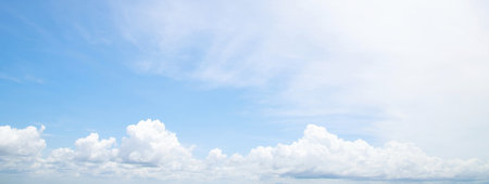 Beautiful clear blue sky background with tiny plain white cloud on morning time rays sunlight. space for text. soft focus.の写真素材