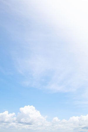 Beautiful clear blue sky background with tiny plain white cloud on morning time rays sunlight. space for text. soft focus.の写真素材