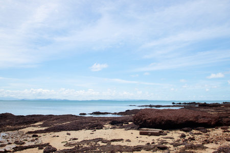 view of sea waves shore and fantastic rocky beach coast on the island and background sky with mountain, Wild nature. Tropical landscape coastline. Summertime. Travel holiday concept.の写真素材