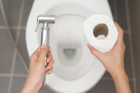 Cleaning staff examining the toilet sprayer.の写真素材