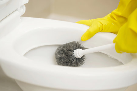 Housewives use brushes to clean the bathroom and take care of sanitary wares.の写真素材