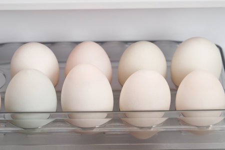 Eggs in the refrigerator, close-up, selective focusの写真素材