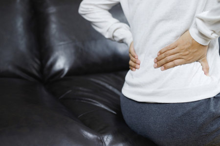 Lower back pain is usually caused by a muscle injury. broken pillowの写真素材