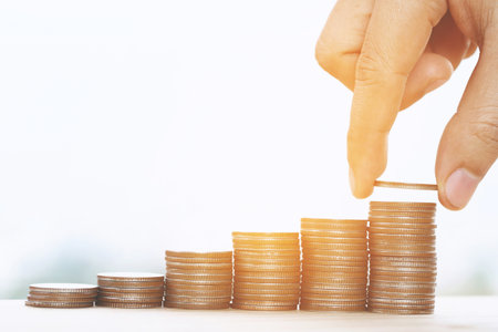 Saving money. businessman hand putting stack coins to show concept of growing savings money finance...