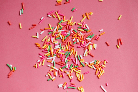 Toppings for donuts, desserts and ice cream on pink background.の写真素材