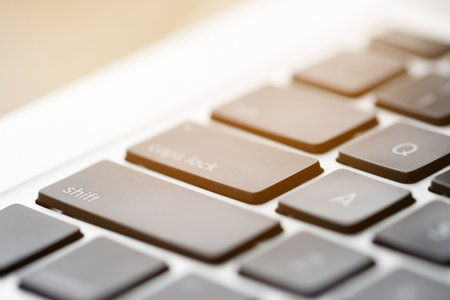 Keyboard on laptop computer with cyber protection conceptの写真素材