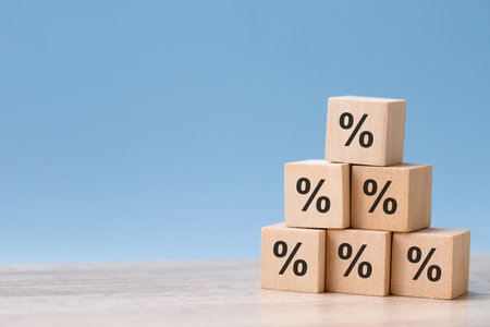 wood cube block with return on investment in stocks, crypto coins, grows according to targetの写真素材