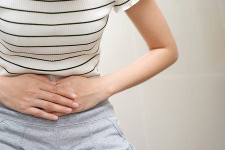 Woman having a stomachache, or menstruation pain. suffering from abdominal. Menstrual cramps. Healthcare and medical, gynecology conceptの写真素材