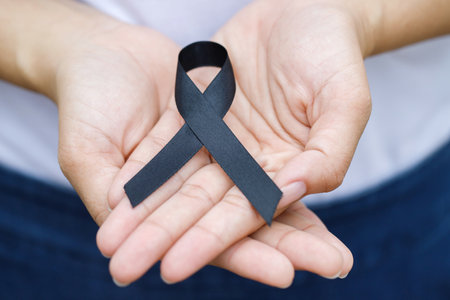 woman with black ribbon For patients with breast and cervical cancer