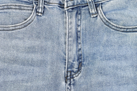 Fashionable denim jeans for teenagers texture backgroundの写真素材