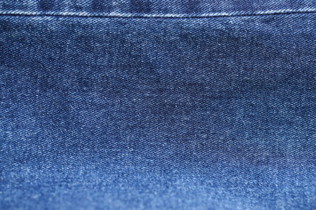 Fashionable denim jeans for teenagers texture backgroundの写真素材