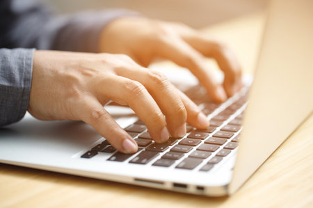 Workers use computers to manage customer databases.の写真素材
