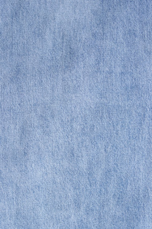 Fashionable denim jeans for teenagers texture backgroundの写真素材