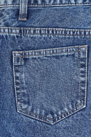 Fashionable denim jeans for teenagers texture backgroundの写真素材