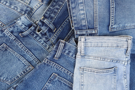 beautiful fashion jeans Stacked in layers at the jeans store