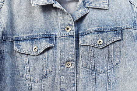 Fashionable denim jeans jacket for teenagers texture backgroundの写真素材
