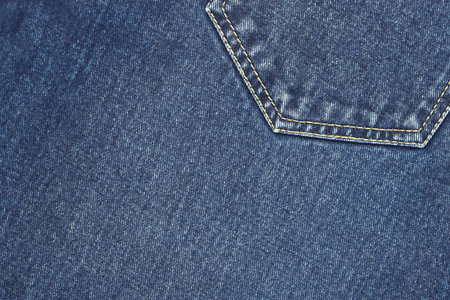 Fashionable denim jeans for teenagers texture backgroundの写真素材