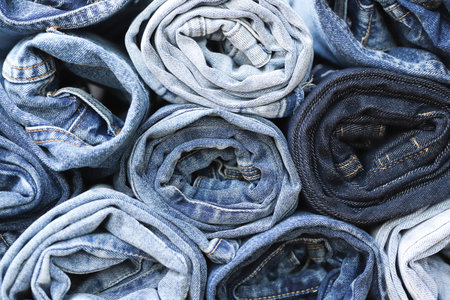 beautiful fashion jeans Stacked in layers at the jeans storeの写真素材
