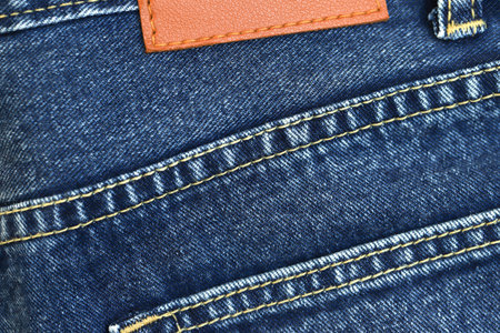 Fashionable denim jeans for teenagers texture backgroundの写真素材
