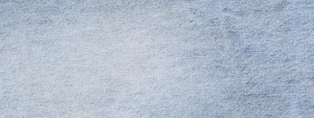Fashionable denim jeans for teenagers texture backgroundの写真素材