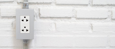 Electrical power socket plug outlet on concrete white wall.の写真素材