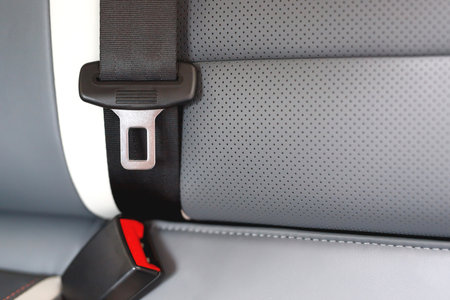 Close Up of fastening seat safety belt in car for before driving on the road. concept transport travel safety. soft focus.の写真素材